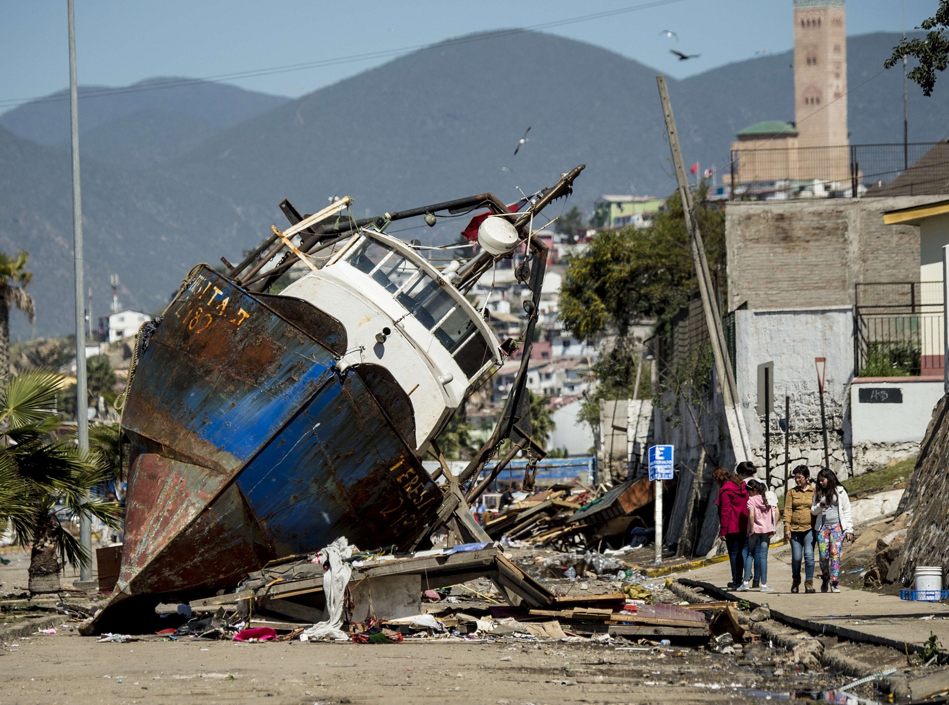 Coquimbo, Chile. A fishing boat is aground in the port of Coquimbo, about 445km north of Santiago, after an 8.3-magnitude earthquake (Martin Bernetti/AFP/Getty Images)